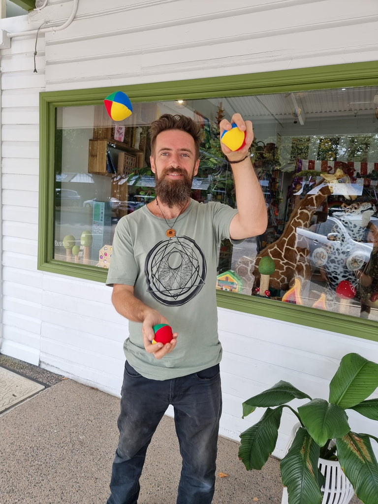 juggling cube balls outside earth toys toy shop store front on sheridan st